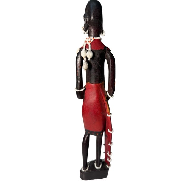 African Maasai warrior statue, hand carved wood with bead decoration and painted details. Tribal art sculpture. Good...