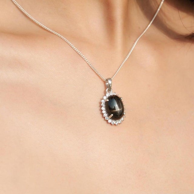Elegant and bold, this black stone pendant is a timeless statement piece crafted in solid sterling silver. Featuring a...