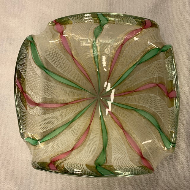 This is a vintage mid-century Italian Murano art glass dish featuring intricate white zanfirico (latticino) filigree lace...