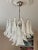 White Murano Chandelier Mazzega-style - medium size. Italian Murano Chandelier in the style of Mazzega. The piece is...