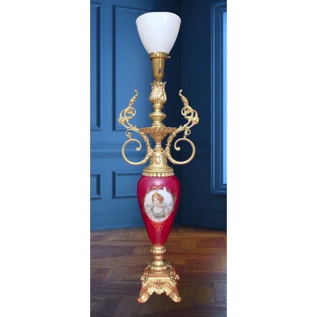 This stunning tall Royal Vienna-style torchiere table lamp has a delicate urn-shaped silhouette.The body of the lamp was...