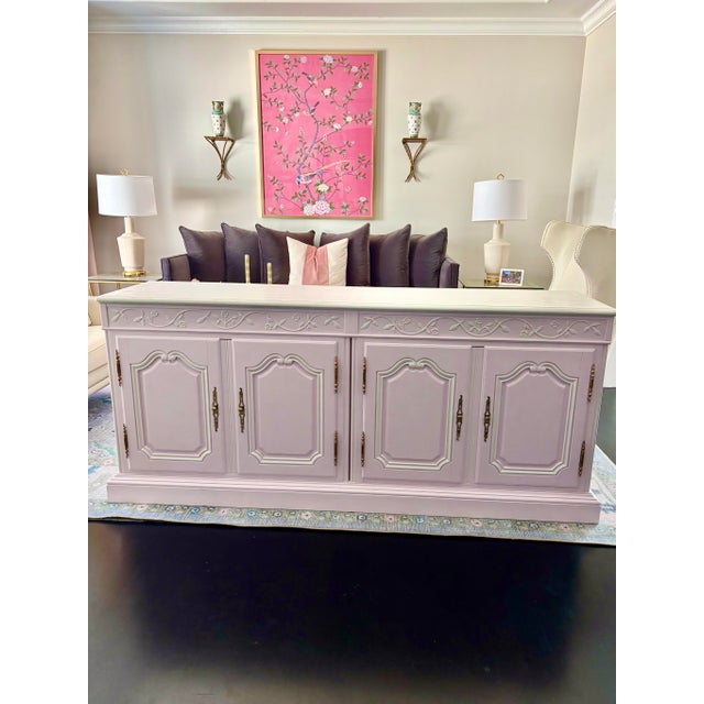 Offered is a solid heavy oak painted credenza sideboard by Baker furniture. This piece features a soft pale “Charleston...