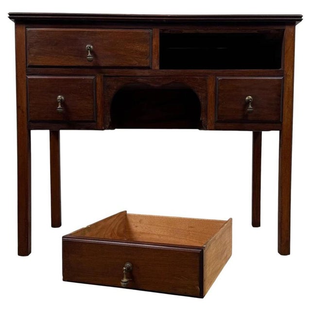 A handsome and well-proportioned early 20th-century English Edwardian writing table, beautifully crafted from mahogany and...