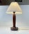 Organically shaped table lamp in engine turned solid rosewood. It features its original bakelit socket and showcases a new...