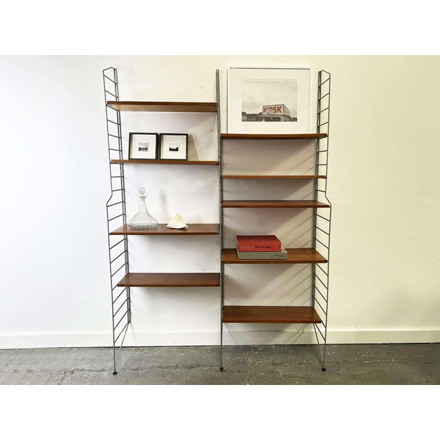 This is a Mid-Century modular wall shelving system by English manufacturer Brianco very similar to The Ladderax system by...