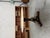Empire-style round table dating from the 1950s. It features an onyx tabletop and a central dark wood base adorned with...
