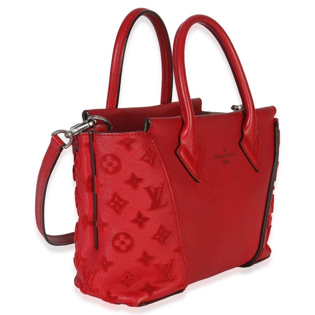 Make waves in the style department with the New Wave bag from Louis Vuitton. A chunky logo adorns the front, while curved...