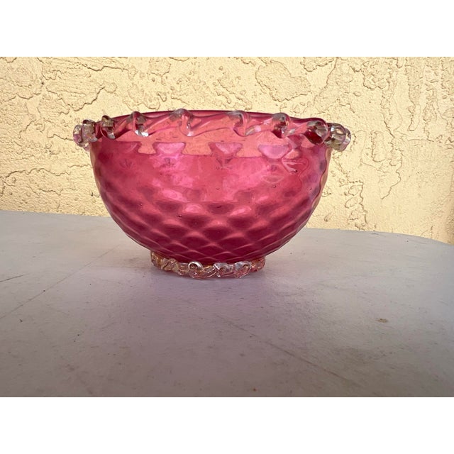 Antique Victorian Cranberry Glass Bowl. This antique shaped cranberry glass bowl has applied rigaree frilled clear on rim...
