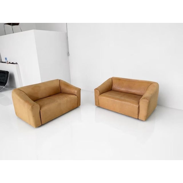 Manufacturer: de Sede Designer: de Sede Design Team Model: 2x DS 47 Upholstery: Neck leather Color: Brown Dimensions:...