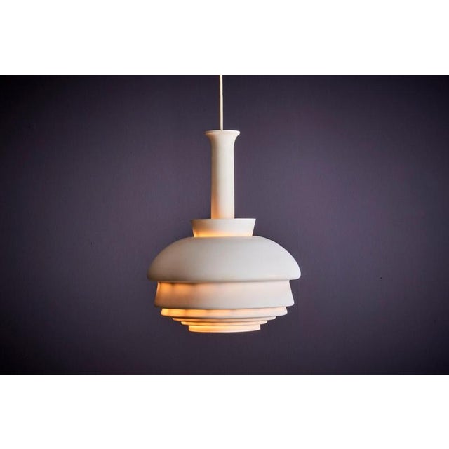Designed by Alvar Aalto in the 1950s, this pendant lamp is a classic example of Scandinavian design. The layered, dome-...