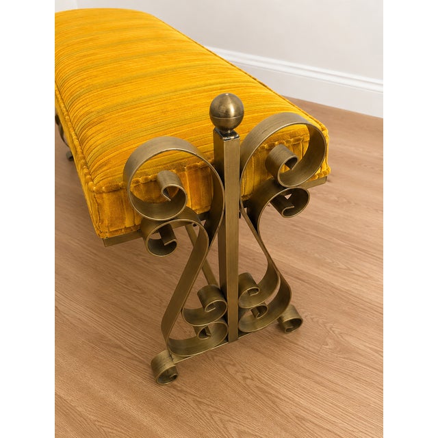 Vintage Swirl Craft bench with brass metal frame with ornate scrollwork. The seat is the original upholstery in a...