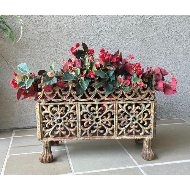 Note: Faux flowers are not included. Exquisite cast iron jardinière/planter which we believe was made in France in the...