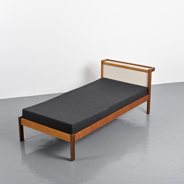 Mahogany bed designed by André Sornay around 1960, crafted using the patented "rod and pin" assembly system,...