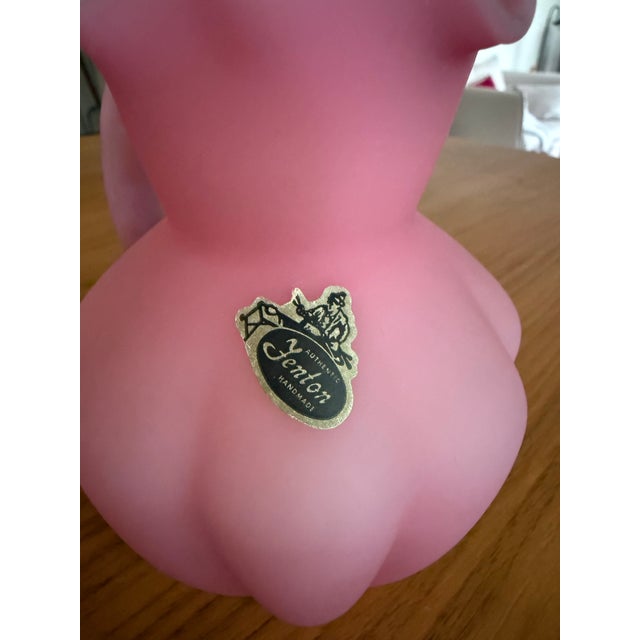 A dreamy confection in rose pink, this authentic Fenton handmade art glass pitcher is the kind of piece that stops you...