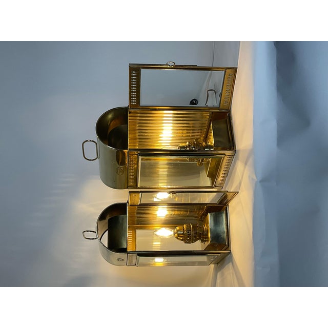 Solid brass ships cabin lanterns by Davey of London. Exceptionally large examples from Davey with three beveled glass...