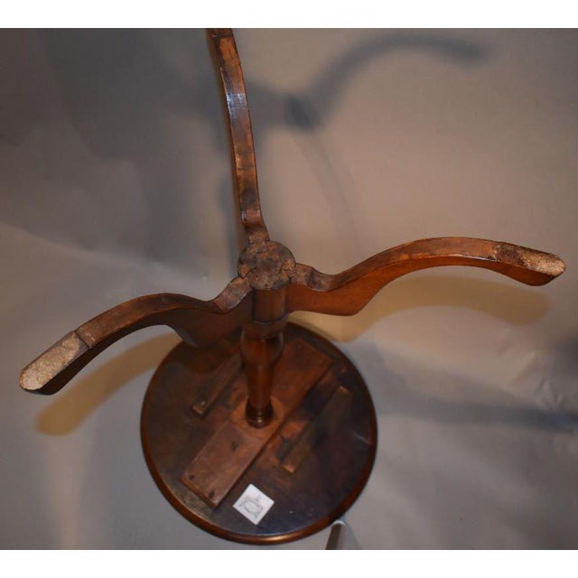 An American Chippendale mahogany candle stand Circa 1760. The finely turned top rests on an urn form pedestal of elegance...