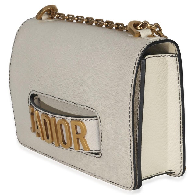 Item #: 152637 Features Interior: Three slip pockets. Two card slots Dimensions: 9.5 x 6.25 x 2.25 in Handbag Closure...