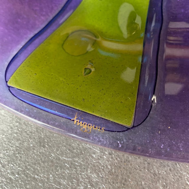This vintage SIGNED Higgins art glass is a round large plate with rich and vivid colors.