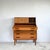A teak bureau that works as a desk, a dressing table and a chest of drawers. The top section pulls out as one piece. Its...
