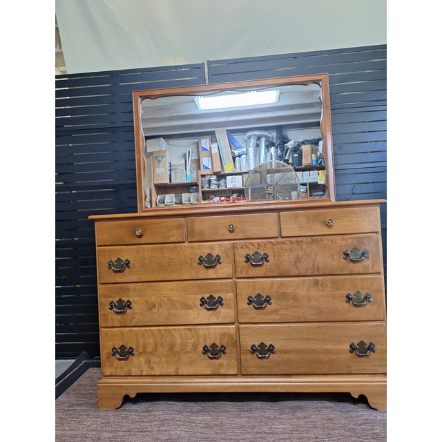 Ethan Allen Heirloom Nutmeg Maple 9 drawer dresser with the original matching scalloped design mirror. Mirror dimensions:...