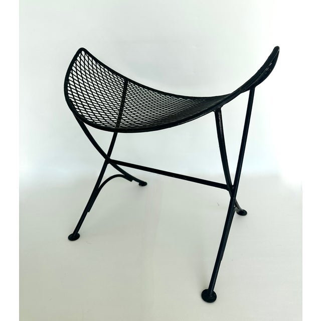 Mid century modern style concave steel stool with mesh seat often referred to as clamshell or orange slice. Original black...