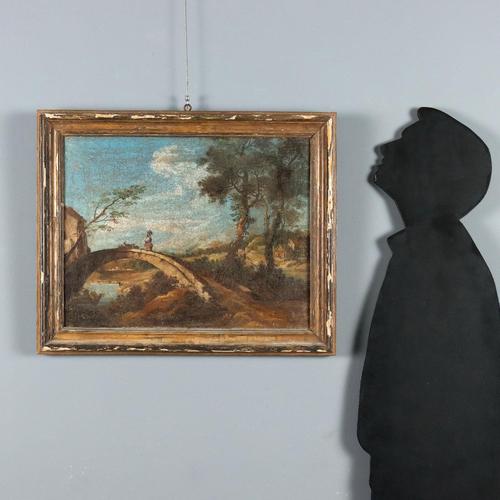 Oil on canvas. Northern Italian School, 18th century. Central Italian landscape, with a cultivated plain, crossed by a...