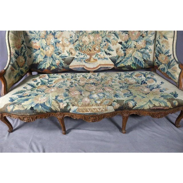 Large basket sofa in walnut of louis xv style covered in aubusson tapestry. This one is in its original state and in good...