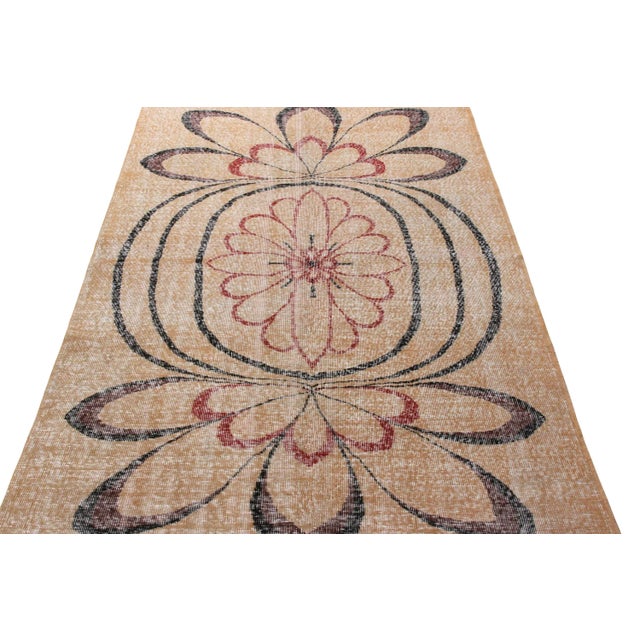 Hand-knotted in wool from Turkey originating between 1960-1970, this vintage mid-century 5x8 Deco rug belongs to Rug &...