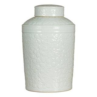 White Porcelain Asian Lidded Jar with Scrolling Foliage Motifs For Sale