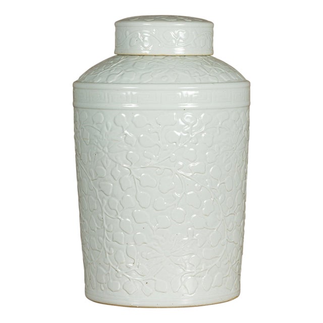 White Porcelain Asian Lidded Jar with Scrolling Foliage Motifs For Sale