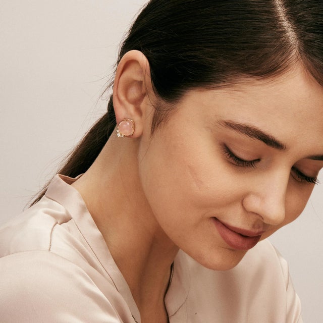 Created in 18 karat yellow gold Pink Chalcedony 14 carats approx. Diamonds 0.15 carat approx. Omega clip-backs & posts...