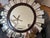 A matching pair of starburst wall mirrors by Three Hands Corp. Segmented mirrored facets radiate from a beveled center...