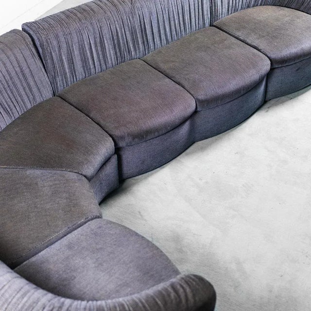 4-module sofa from the 1970s. Upholstery in blue patterned fabric. Wooden feet. Good condition, signs of time and use...