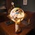 Illuminated world globe on a heavy marble column Sits on a stepped brass and mahogany wood base Accented with ornate brass...