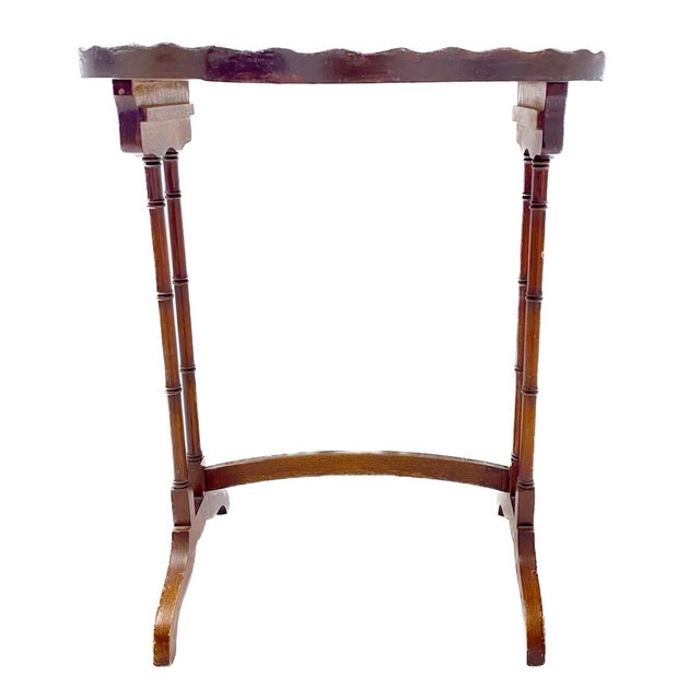 Vintage scalloped handpainted floral faux bamboo oval side table. Scalloped top gallery and wood faux bamboo legs. No...