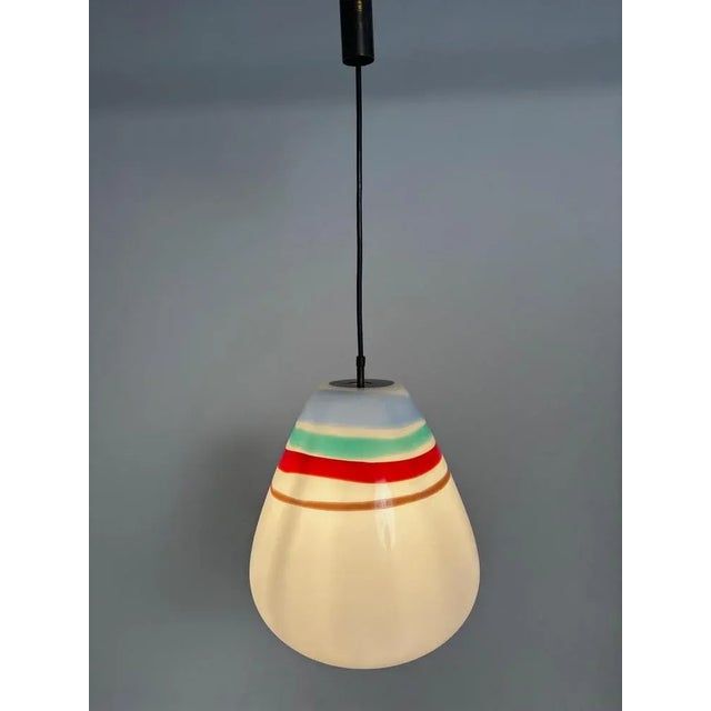 This elegant pendant lamp is a classic example of mid-century Italian design, created by renowned designer Massimo...