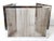 A chrome fireplace screen with metal mesh. Central panel and two collapsible lateral panels. Curtain-style mesh.