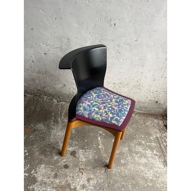 Introduction Set of four postmodern chairs designed by Francesco Binfaré for Cassina in the 1980s. These chairs are a...