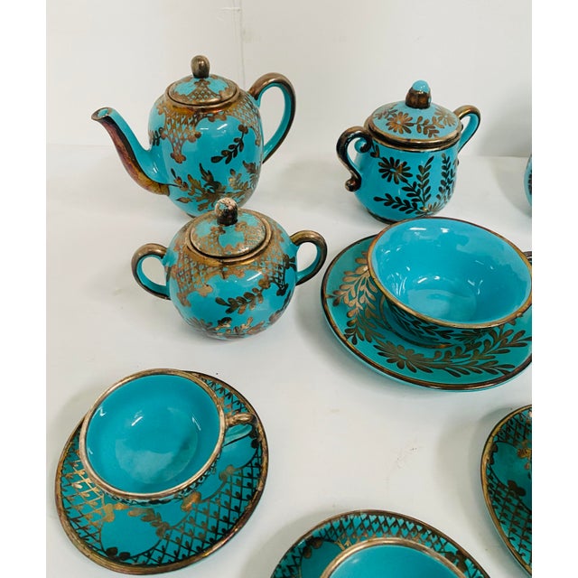 Polychrome porcelain tea and coffee service The service comprises 14 pieces: 8 coffee cups and saucers 1 coffee pot and 1...