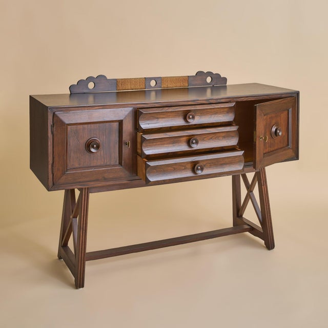An Italian sideboard dating to the 1930s, crafted in richly toned dark wood and defined by its balanced proportions and...