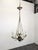 Empire Black and Gilt Chandelier, France, in Very Good conditions. Designed before 1890 European Plug (up to 250V).The...