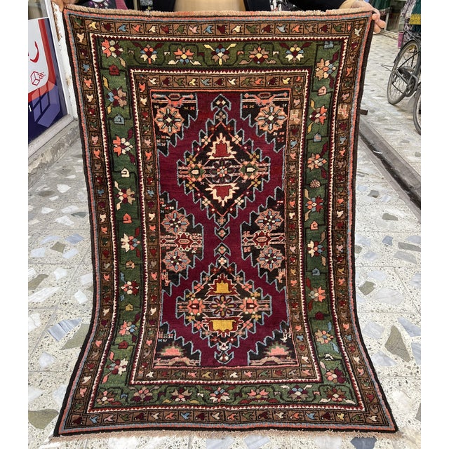 Persian Hamadan design hand-knotted rug featuring two stacked stepped diamond medallions outlined in soft blue zigzag and...