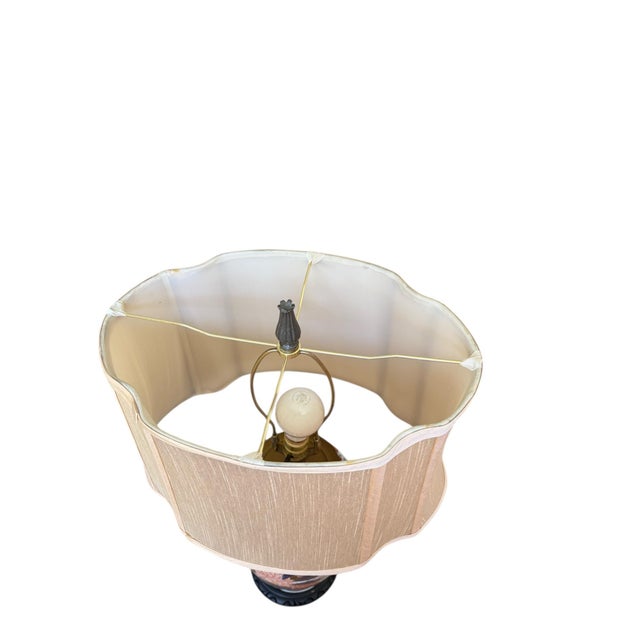 Offering a large hand painted porcelain lamp featuring a Chinoiserie/Japanese style with a dynamic Imari design in blue,...