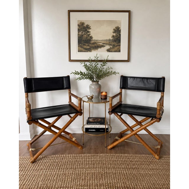 Elegant pair of vintage McGuire San Francisco director chairs featuring black leather sling seats and backs, warm oak...