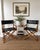 Elegant pair of vintage McGuire San Francisco director chairs featuring black leather sling seats and backs, warm oak...