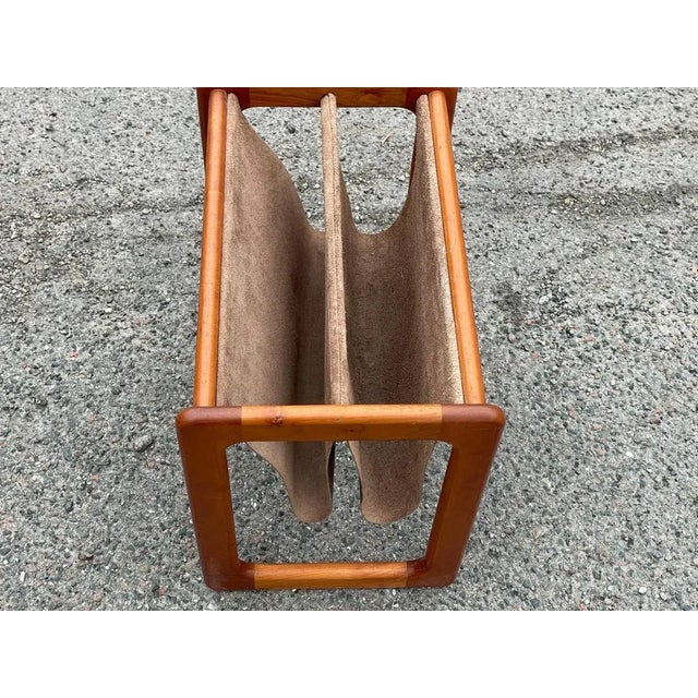 Introducing the essence of Danish Mid-Century Modern design: a magazine holder crafted in teak and brown leather. Elevate...