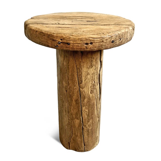 Rustic vintage old wood side table with round top and log pedestal base. Each slightly unique in natural wood tones,...