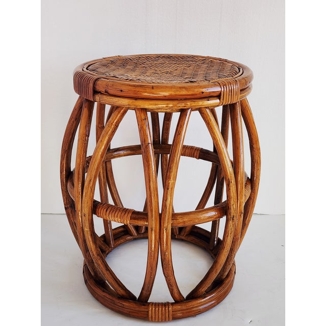 Vintage 1960's bent bamboo and woven rattan drum stool or side table. The handcrafted piece has a beautiful patina, it is...