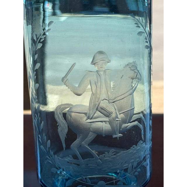 This etched antique glass vase features a military horse and rider framed by a laurel wreath. I found only one other...
