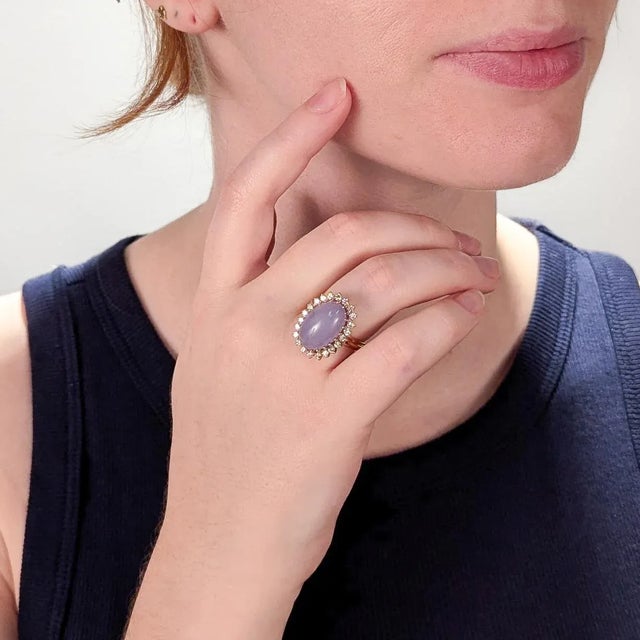 A fine vintage gold, lavender jadeite, and diamond cocktail ring. In 14 karat yellow gold. With a high-set 11.65± Ctw...